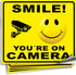 iSYFIX Smile You're On Camera Stickers for Home - 4 Pack 7x6 Inch Decals for Inside the Window or Glass, Security