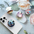 Translucent Clear Phone Grip with Expanding Kickstand, Collapsible Stand for Smartphones in Pink Blue White